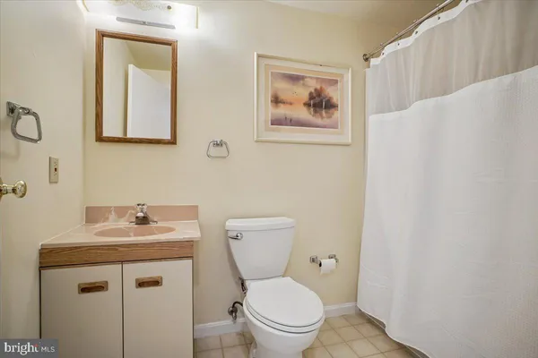 a utility room with cabinets washer and dryer