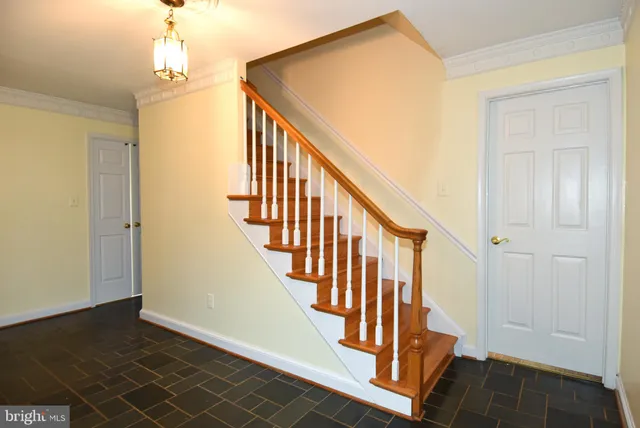 a view of an entryway with wooden floor