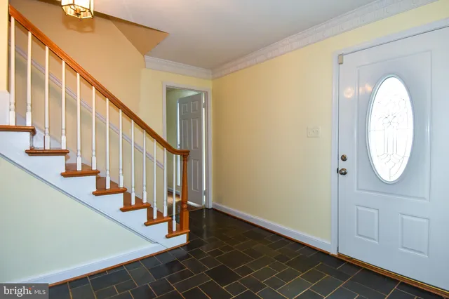 a view of an entryway with wooden floor