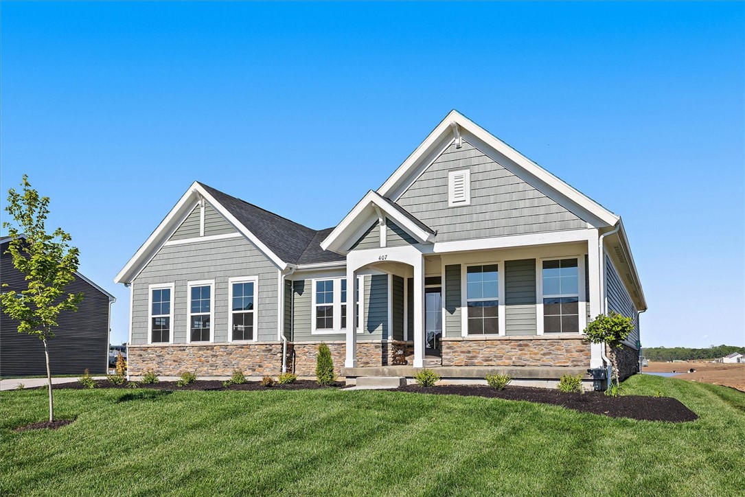 407 South Landon Lane Springfield, OH 45502 - Photo 29 of 30 This newly constructed residence showcases an attractive blend of siding and stone, set amidst a verdant lawn.