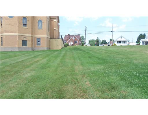 Railroad Street Perryopolis, PA 15473 - Photo 7 of 7 Exterior Front. Facing west, the area that runs next to the church and along the back of the lot is a grass alley.