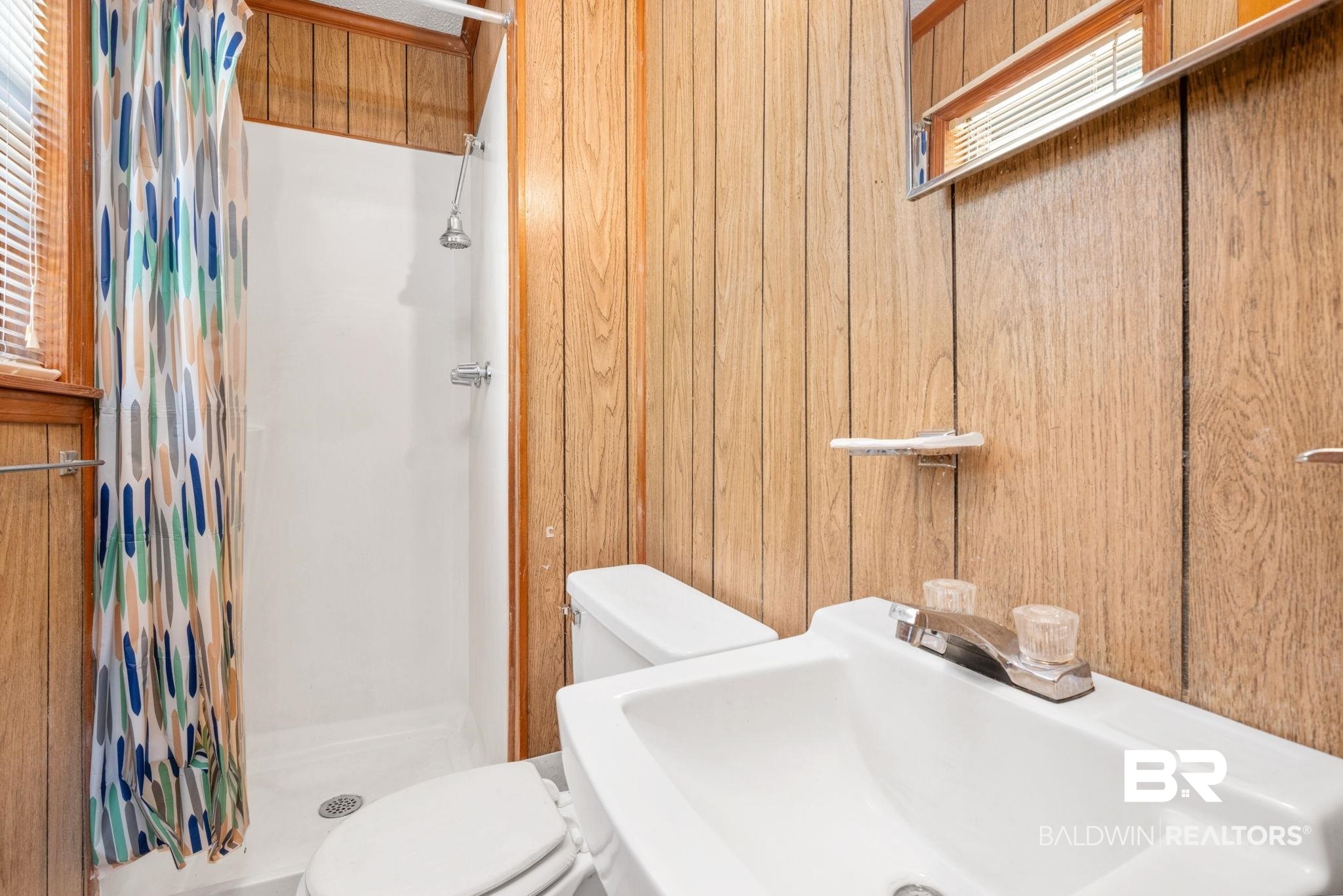 1456 Herman Williams Road Fruitdale, AL 36539 - Photo 13 of 24 Bathroom featuring toilet, wood walls, walk in shower, and sink