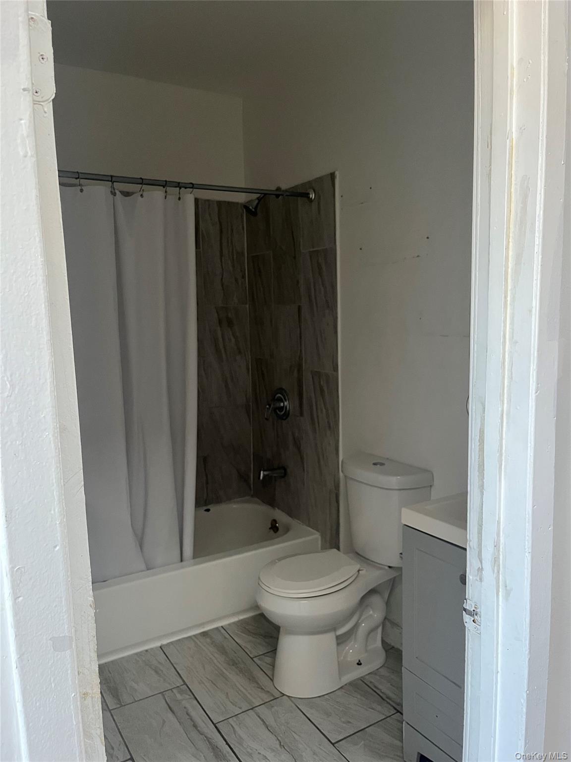 2393 Walton Avenue Bronx, NY 10468 - Photo 13 of 13 a bathroom with a toilet and a shower