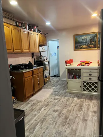 a kitchen with stainless steel appliances a stove refrigerator and a oven