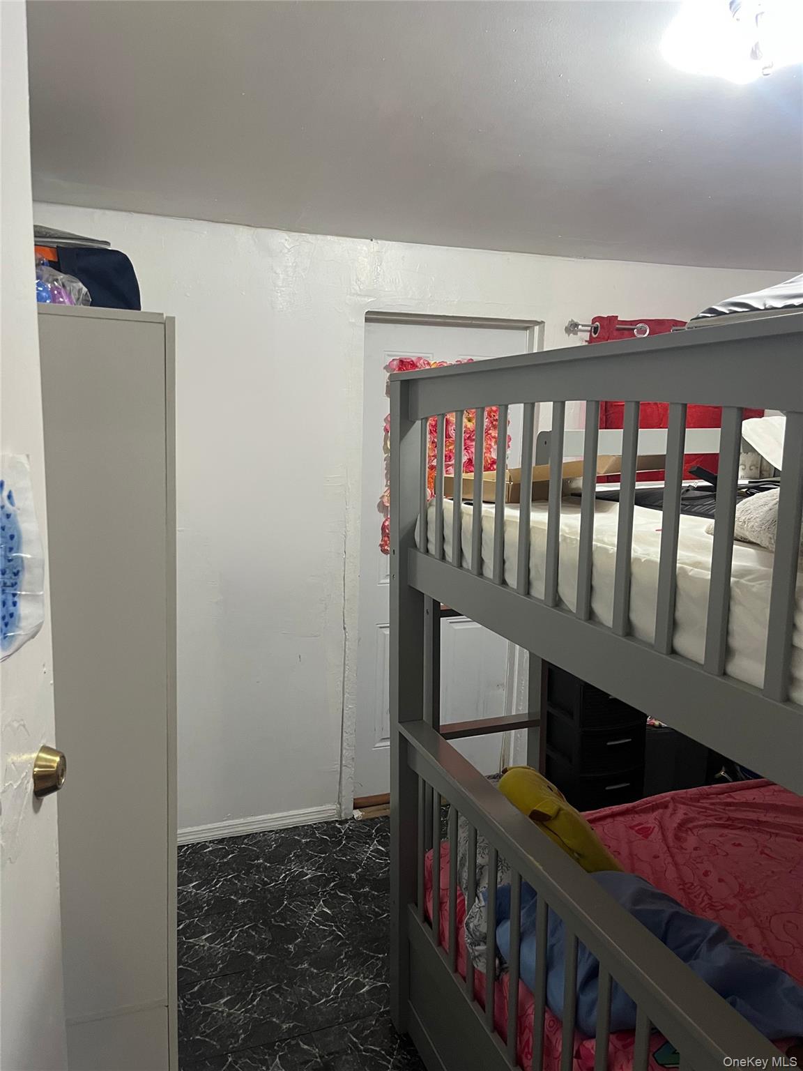 2393 Walton Avenue Bronx, NY 10468 - Photo 4 of 13 a bedroom with furniture and a window