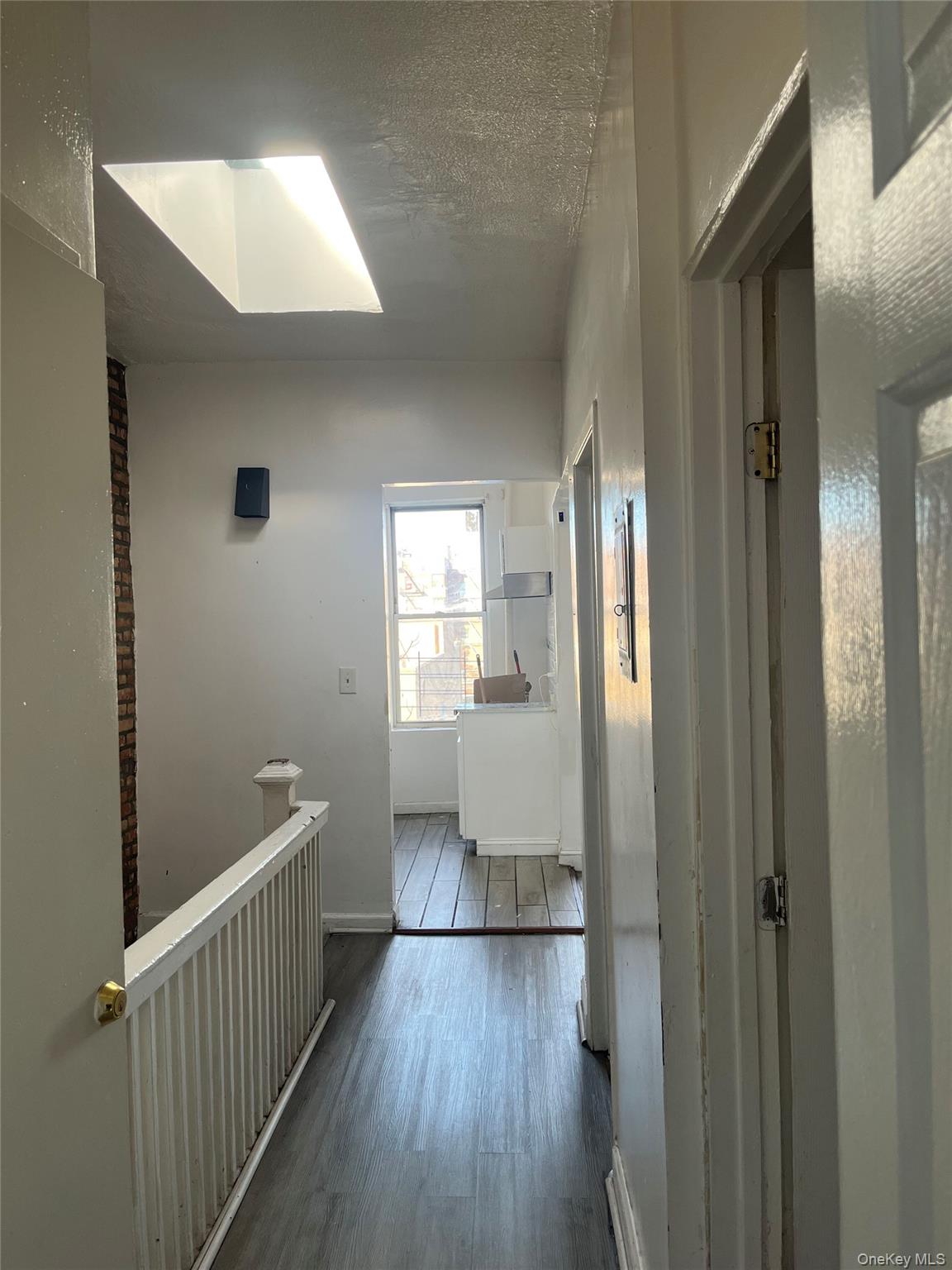 2393 Walton Avenue Bronx, NY 10468 - Photo 8 of 13 a view of hallway with wooden floor