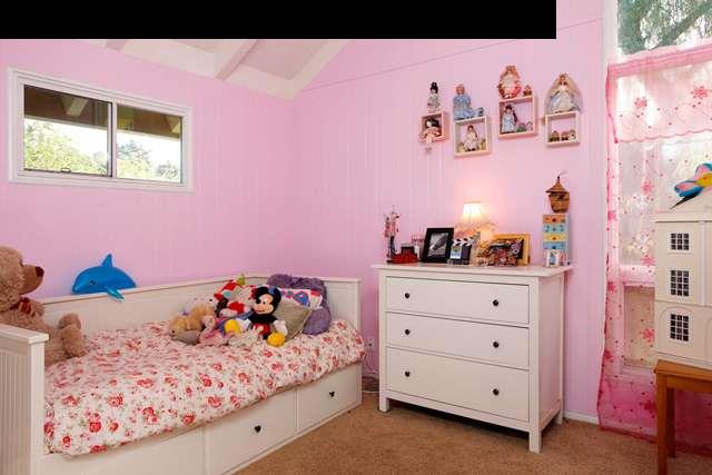 223 Ainakula Road Kula, HI 96790 - Photo 18 of 30 a bedroom with a bed and a dresser