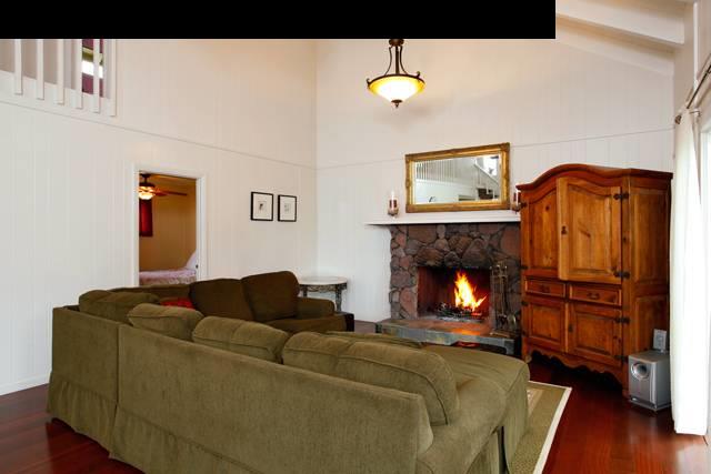 223 Ainakula Road Kula, HI 96790 - Photo 2 of 30 a living room with furniture and a fireplace