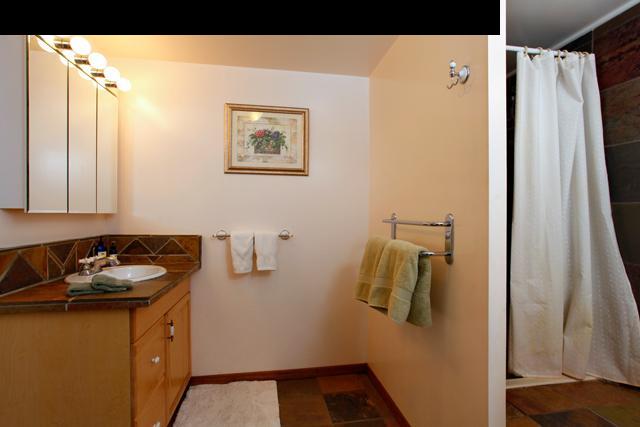 223 Ainakula Road Kula, HI 96790 - Photo 23 of 30 a bathroom with a sink and mirror