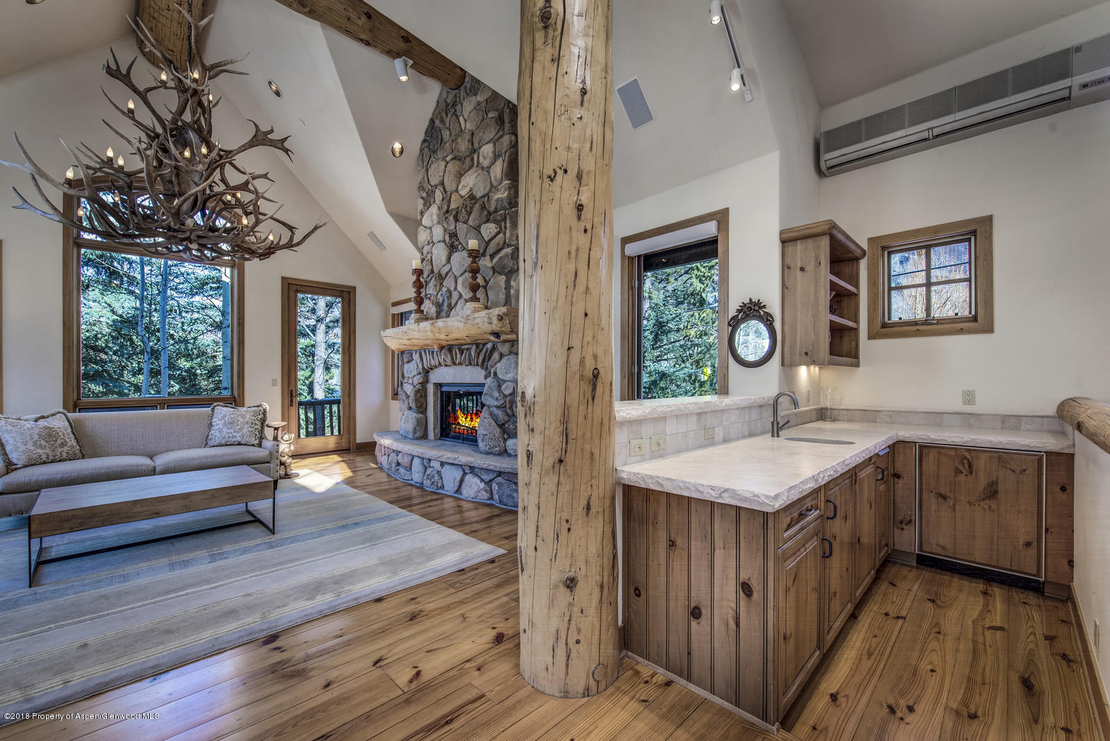 1395 Riverside Drive Aspen, CO 81611 - Photo 5 of 27 Wet bar and living room