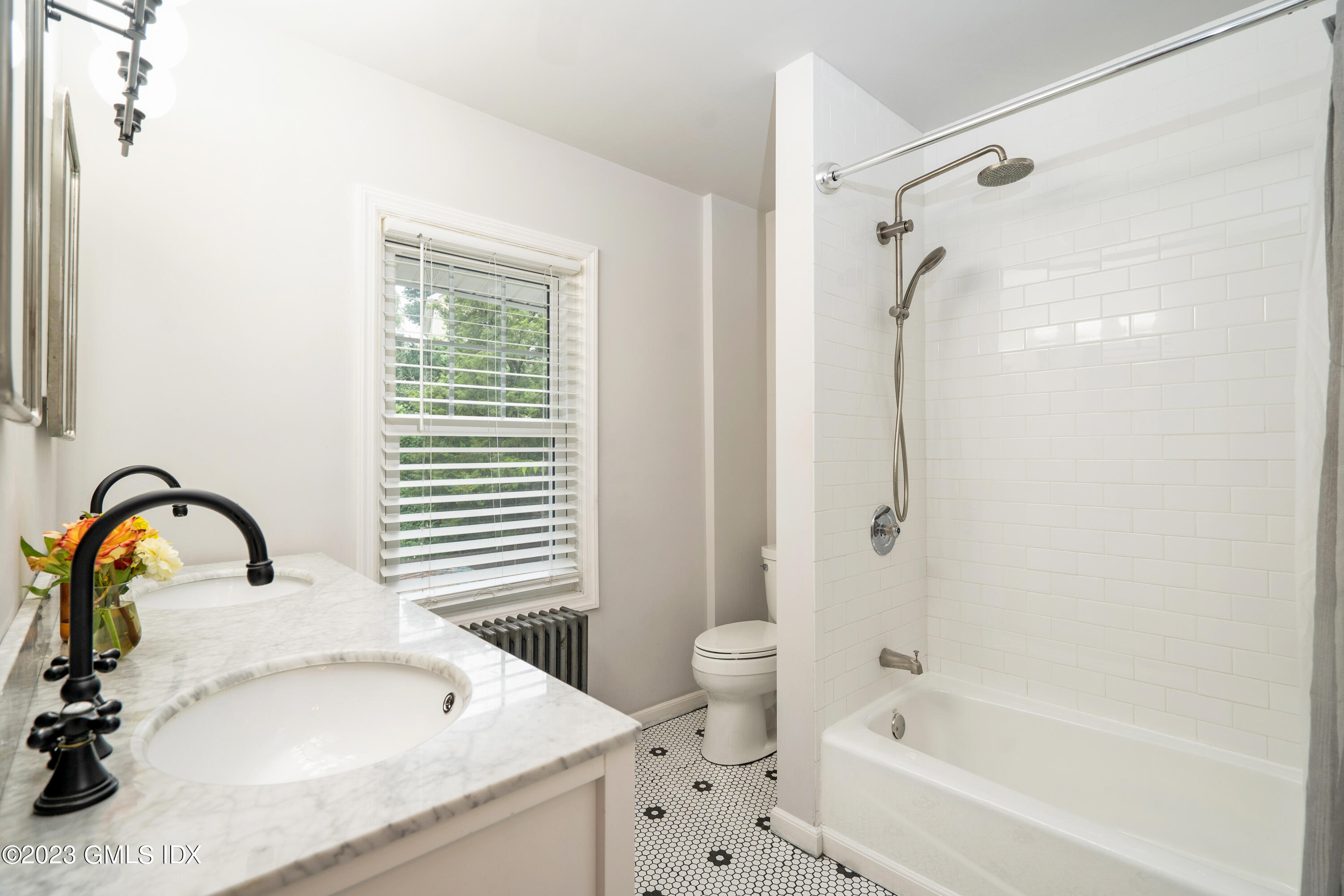 328 Delavan Avenue Greenwich, CT 06830 - Photo 16 of 25 a bathroom with a sink and a bathtub