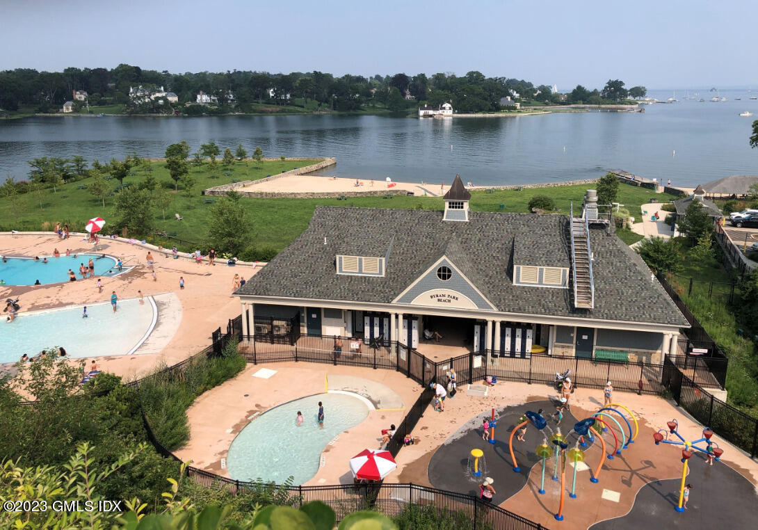328 Delavan Avenue Greenwich, CT 06830 - Photo 24 of 25 an aerial view of a house with swimming pool and lake view