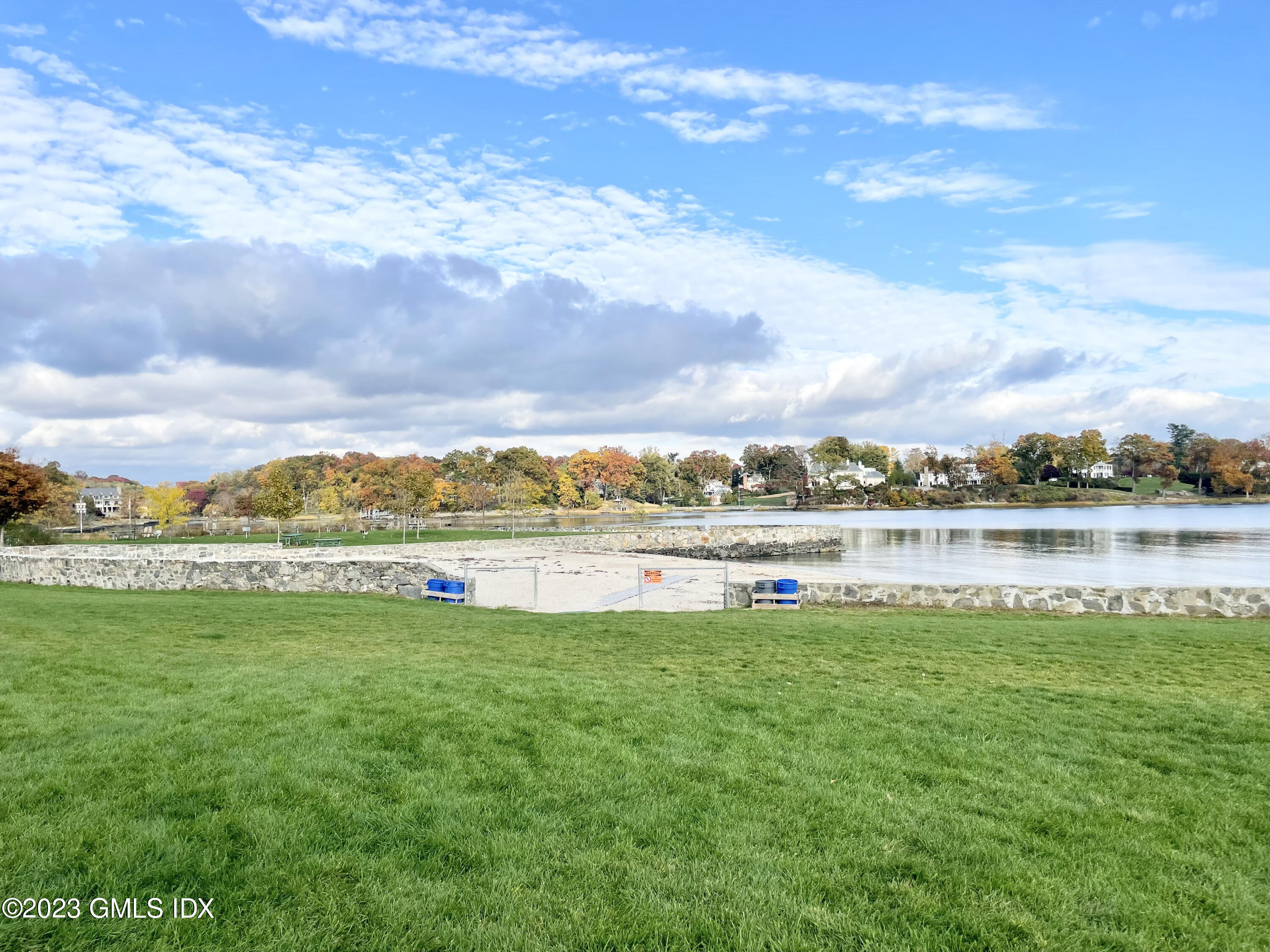 328 Delavan Avenue Greenwich, CT 06830 - Photo 25 of 25 a view of a lake with a big yard