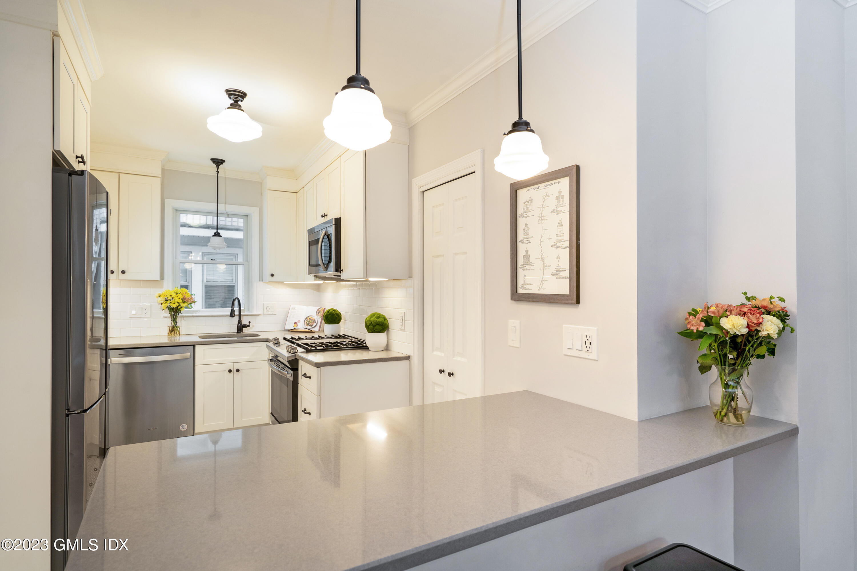 328 Delavan Avenue Greenwich, CT 06830 - Photo 7 of 25 a kitchen with stainless steel appliances granite countertop a sink a stove and a refrigerator