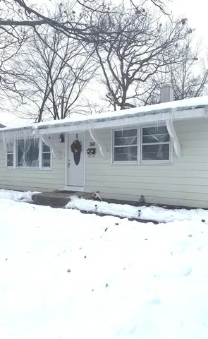 a side view of a house with a outdoor space