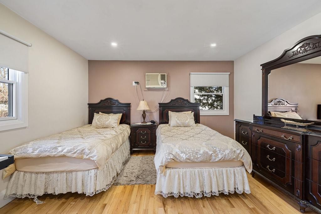 79 Francis Place Spring Valley, NY 10977 - Photo 16 of 37 a bedroom with double bed and a night stand
