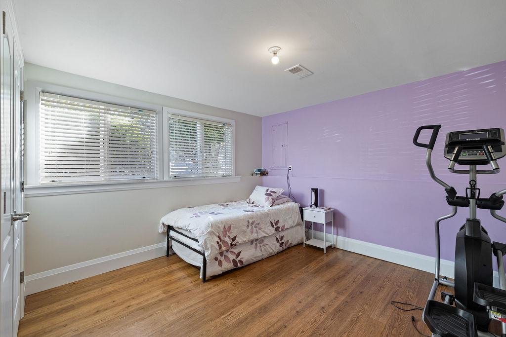 79 Francis Place Spring Valley, NY 10977 - Photo 20 of 37 a bedroom with a bed and wooden floor