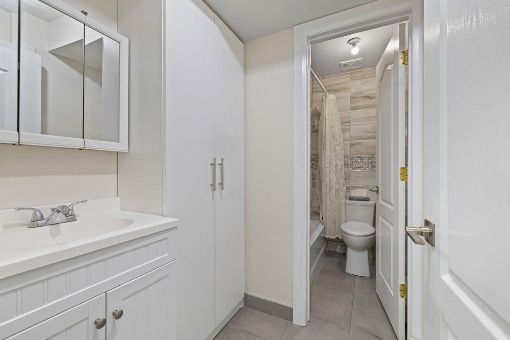 79 Francis Place Spring Valley, NY 10977 - Photo 26 of 37 a bathroom with a sink a toilet and shower