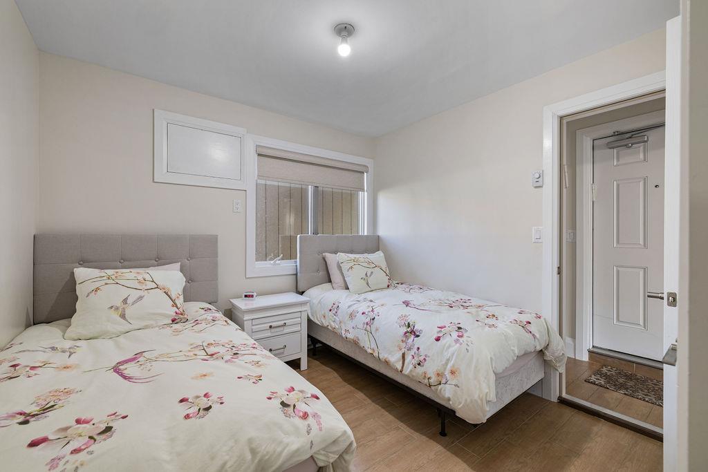 79 Francis Place Spring Valley, NY 10977 - Photo 29 of 37 a bedroom with two beds and a night stand