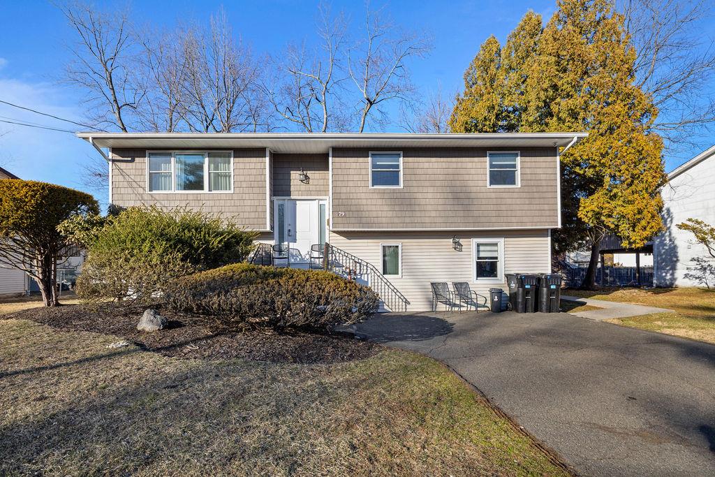 79 Francis Place Spring Valley, NY 10977 - Photo 31 of 37 a front view of a house with a yard