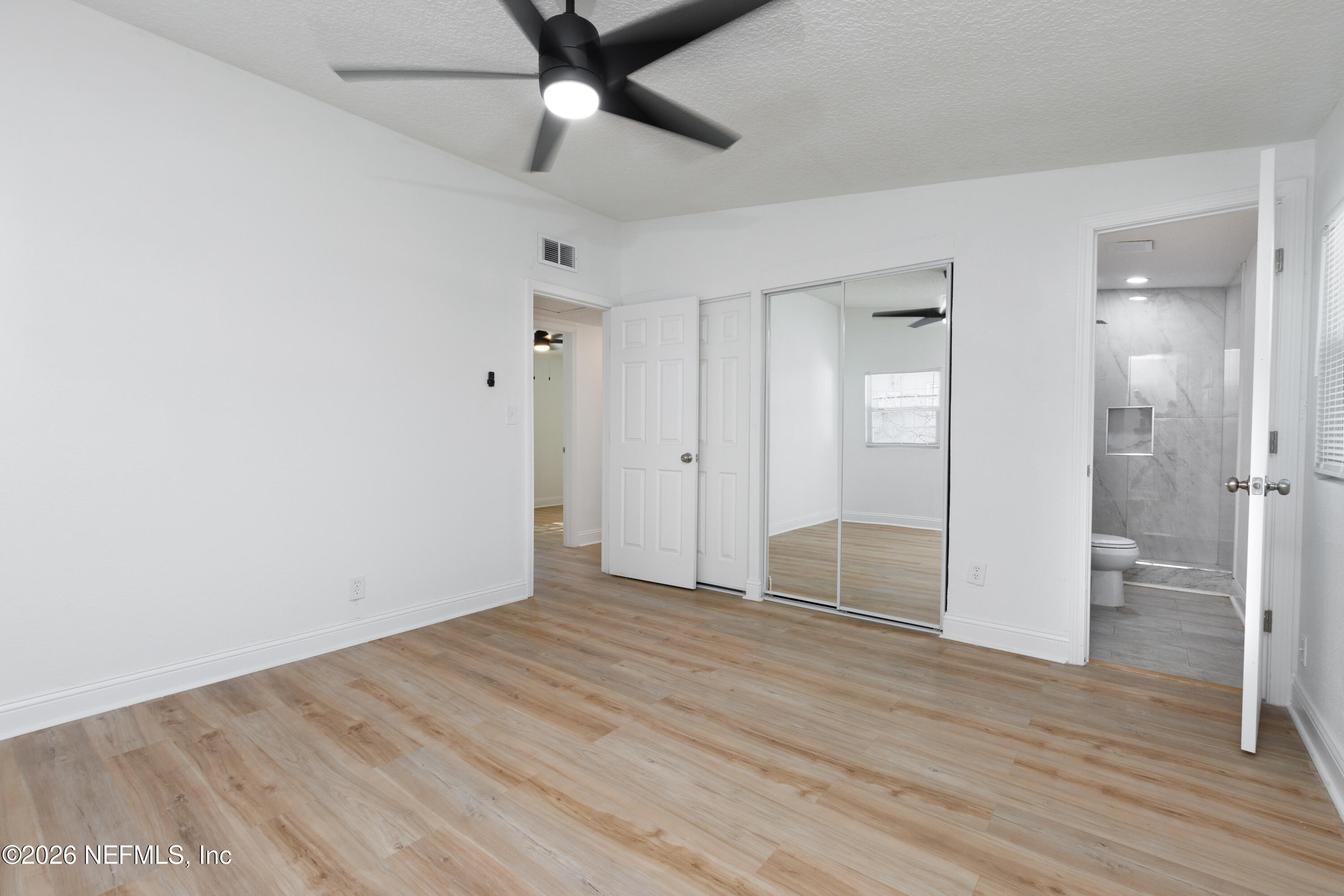 203 Rio Road Jacksonville, FL 32218 - Photo 11 of 27 wooden floor in an empty room