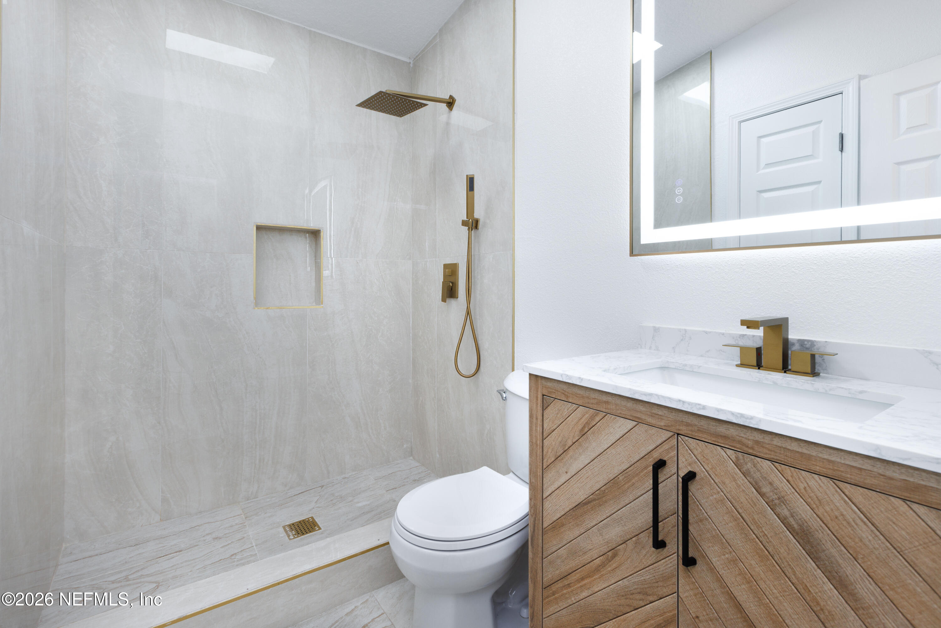 203 Rio Road Jacksonville, FL 32218 - Photo 12 of 27 a bathroom with a granite countertop sink toilet and shower