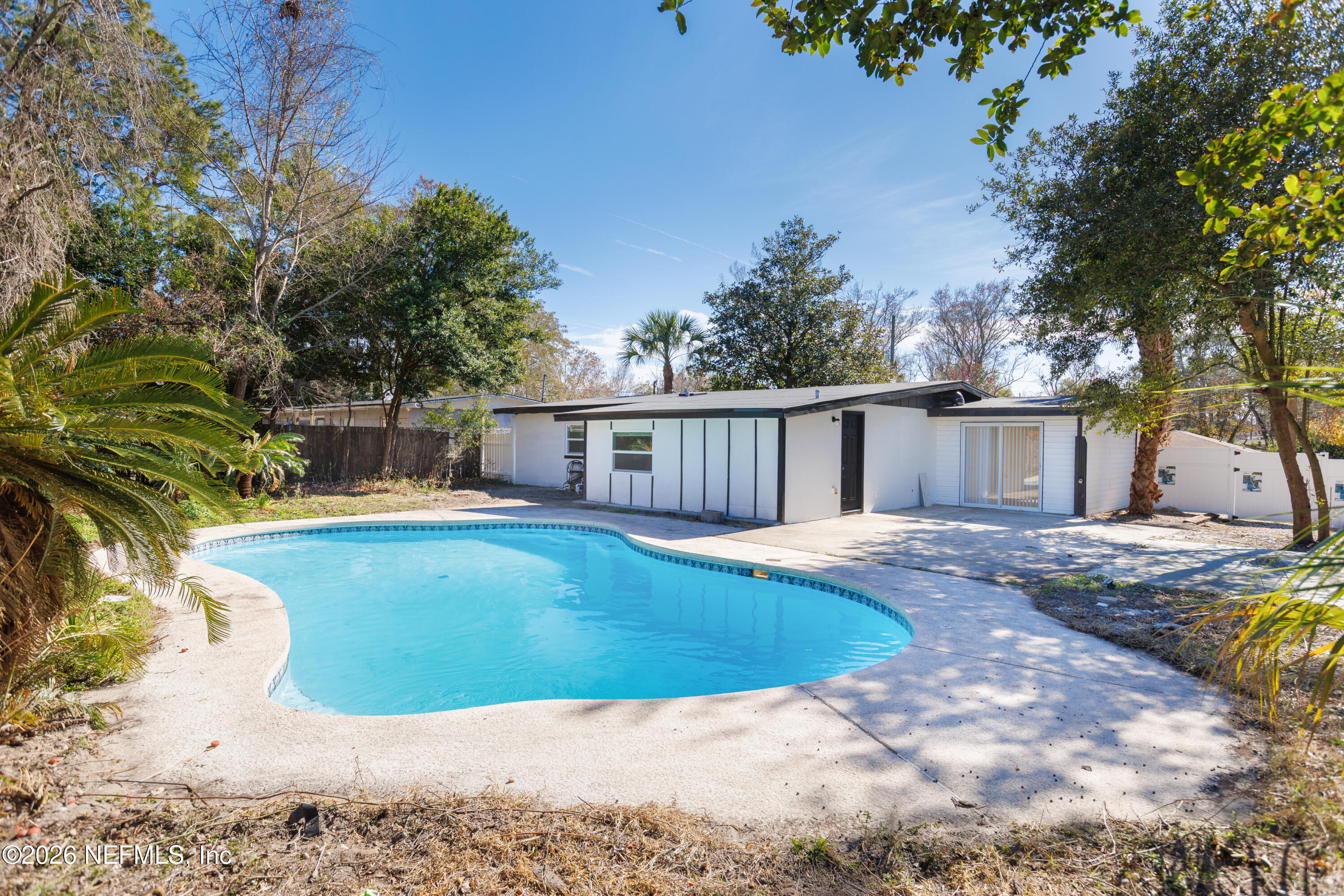 203 Rio Road Jacksonville, FL 32218 - Photo 20 of 24 a view of a house with pool and sitting area