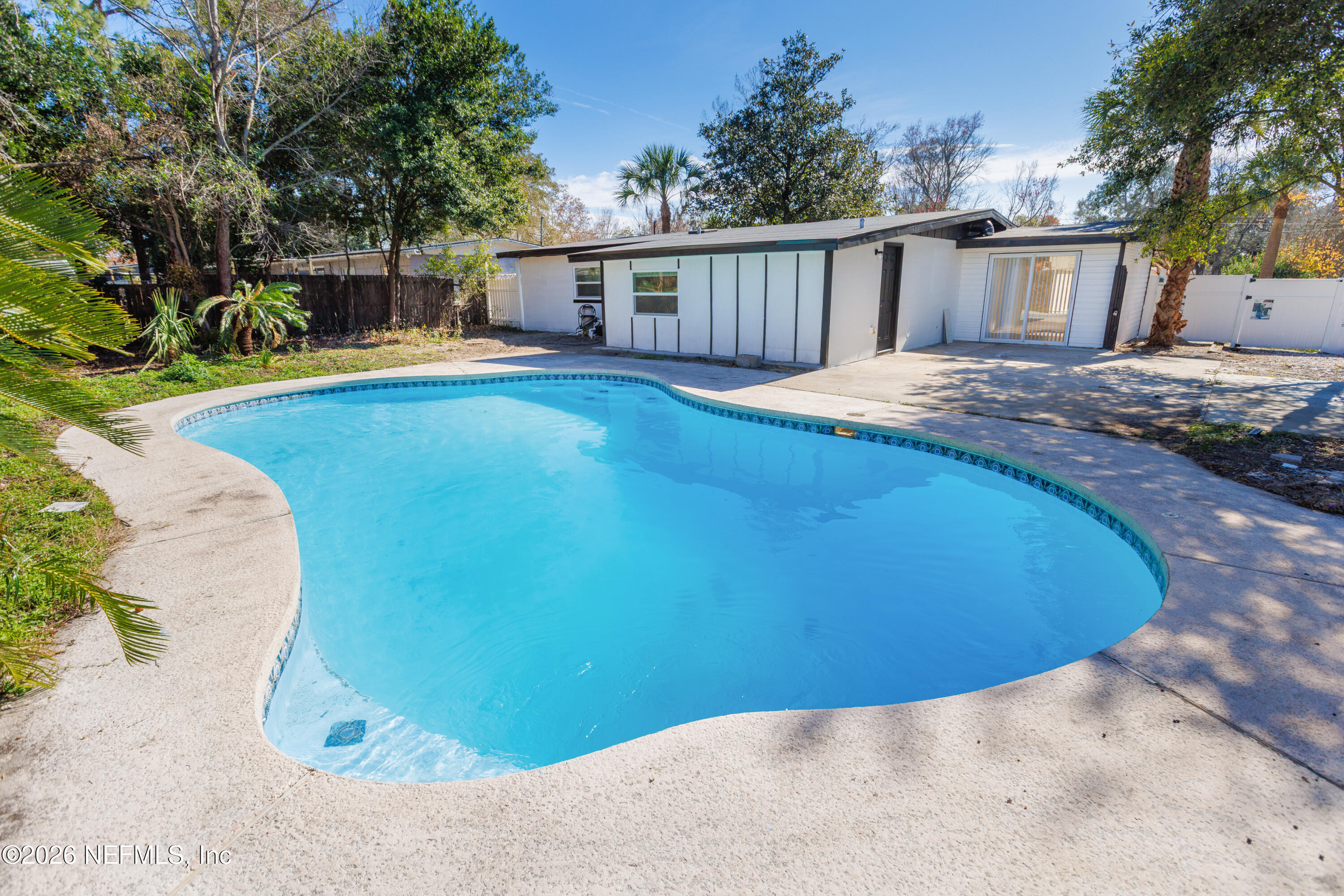 203 Rio Road Jacksonville, FL 32218 - Photo 22 of 27 a view of a house with swimming pool