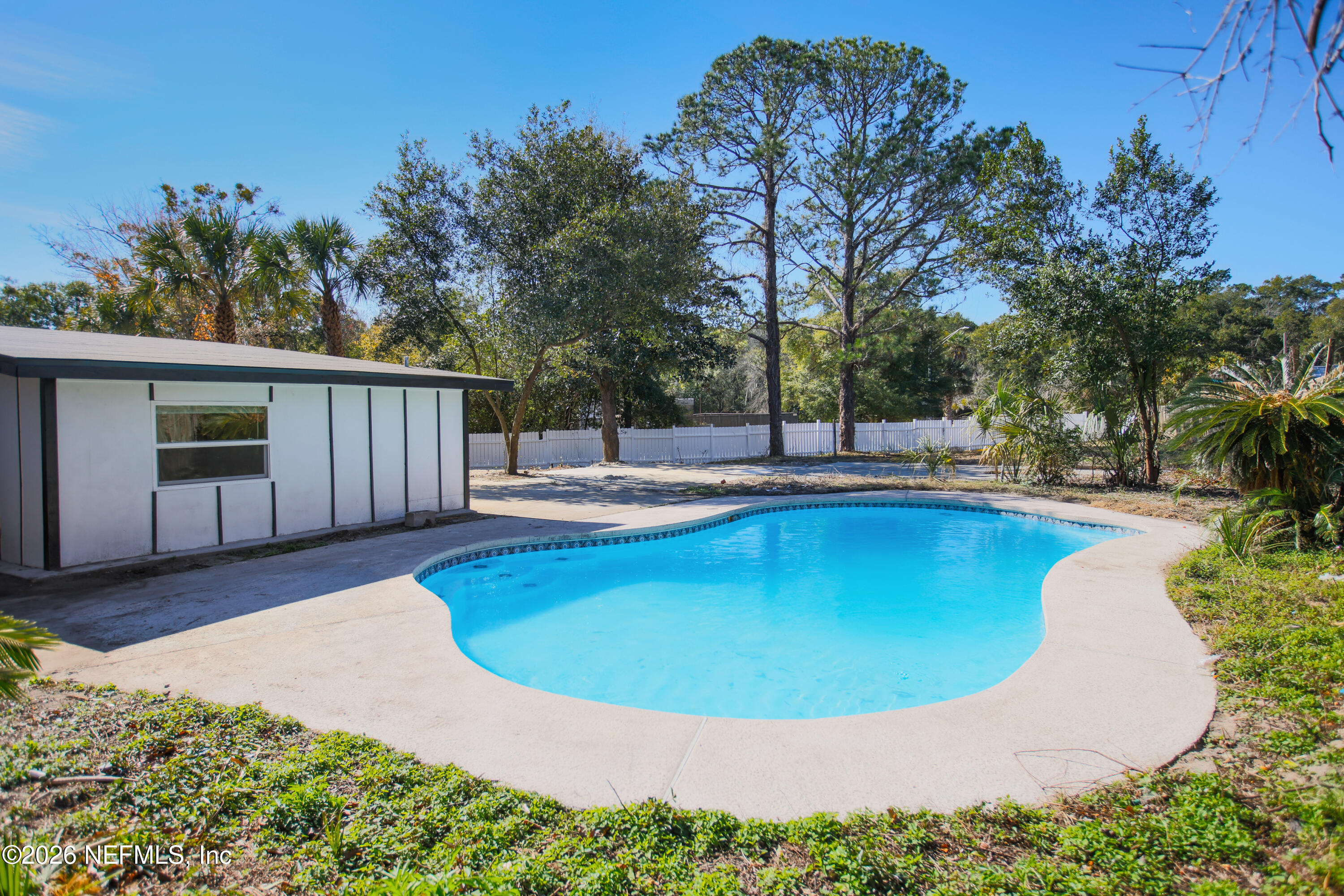 203 Rio Road Jacksonville, FL 32218 - Photo 23 of 27 a view of a swimming pool with a patio