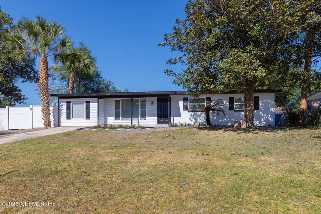 front view of a house with a trees