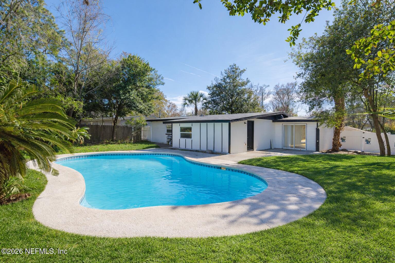 203 Rio Road Jacksonville, FL 32218 - Photo 26 of 27 a view of a house with a swimming pool