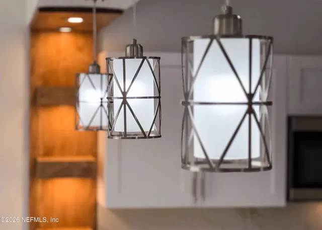 a kitchen with stainless steel appliances a refrigerator sink and microwave