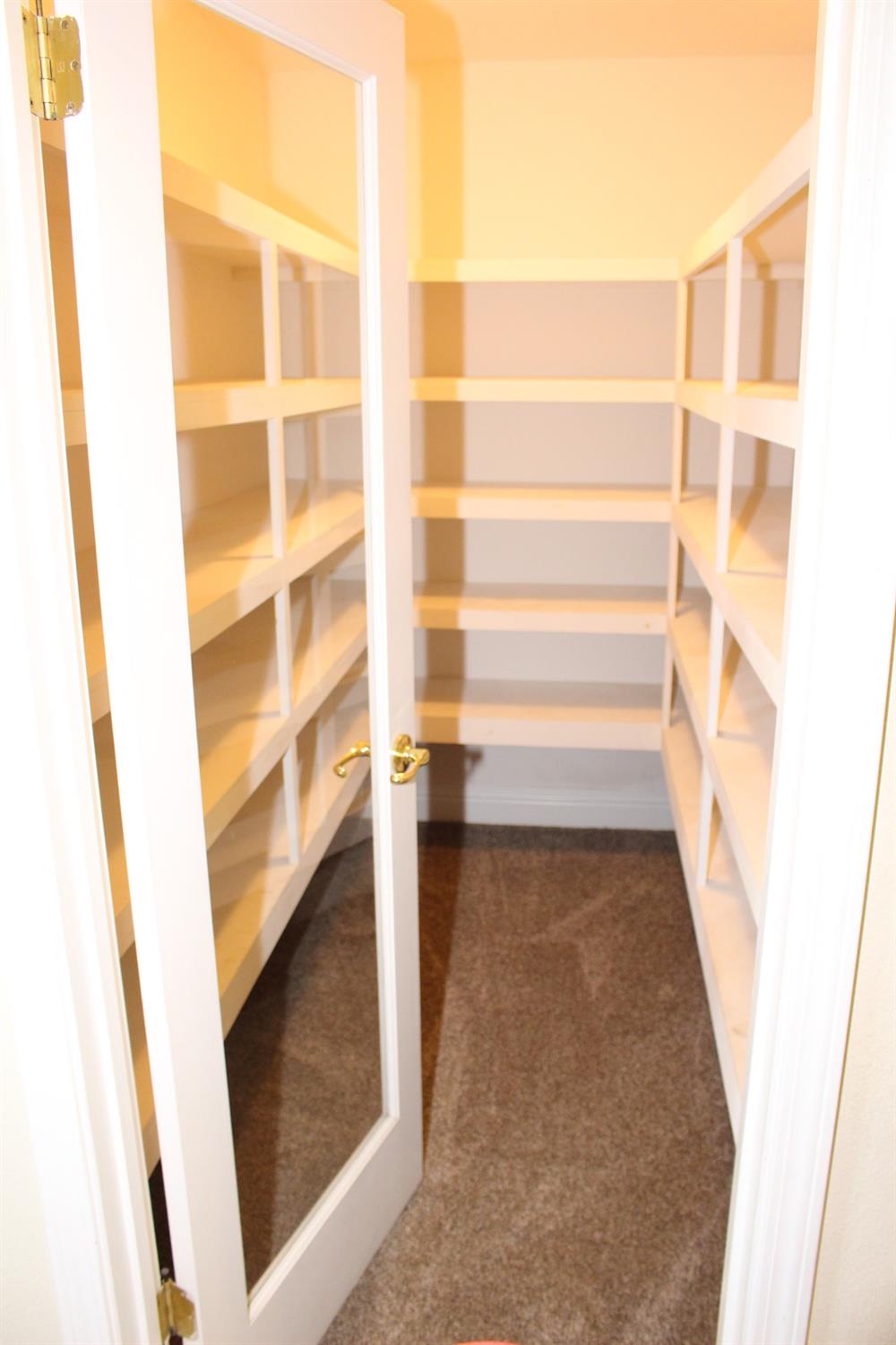 2478 Rall Avenue Clovis, CA 93611 - Photo 12 of 35 a view of walk in closet with empty racks