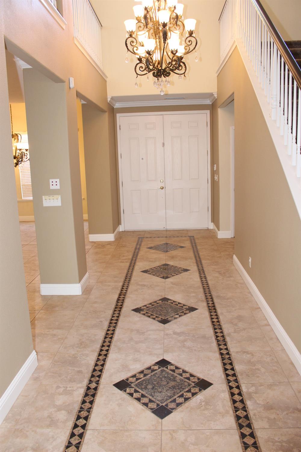 2478 Rall Avenue Clovis, CA 93611 - Photo 4 of 35 en empty room with wooden floor and windows