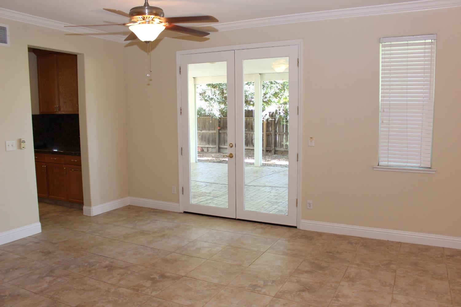 2478 Rall Avenue Clovis, CA 93611 - Photo 7 of 35 an empty room with chandelier fan
