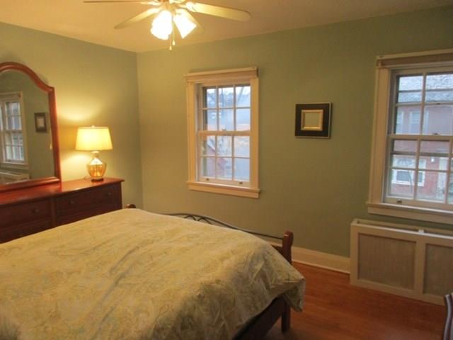 542 Bigham Road Pittsburgh, PA 15211 - Photo 12 of 25 The master bedroom looks out over the courtyard and features hardwood floors, a large closet.