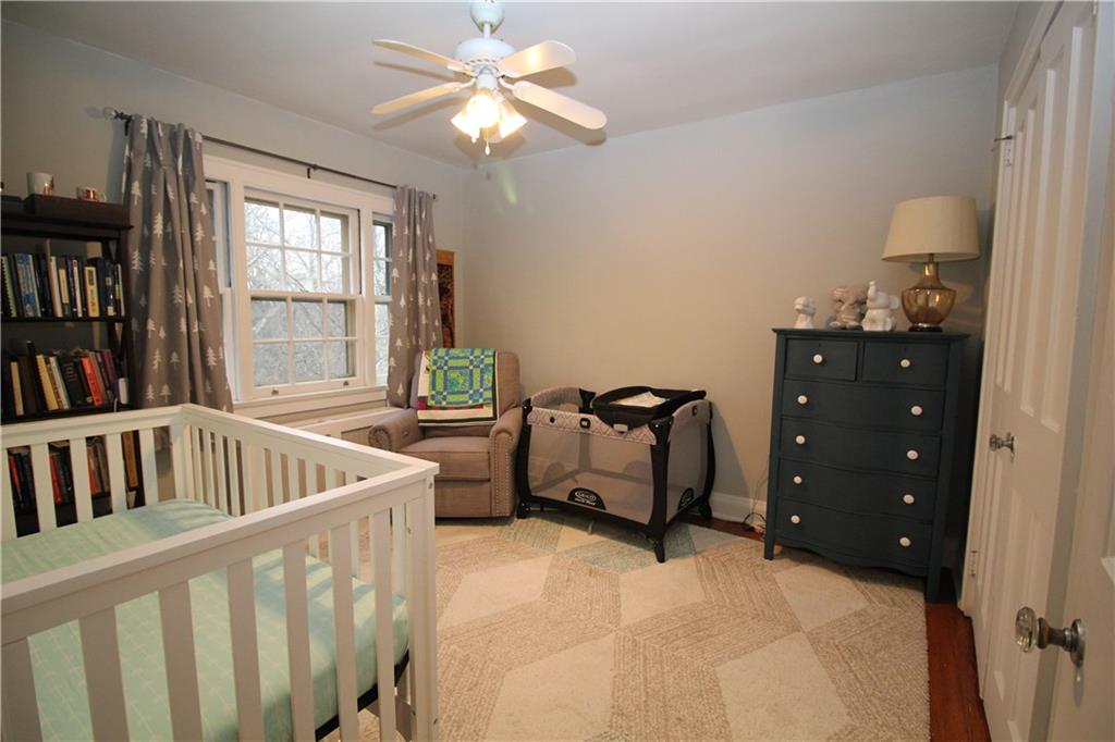 542 Bigham Road Pittsburgh, PA 15211 - Photo 15 of 25 The second bedroom features hardwood floors, picture window, and large closet with French doors.