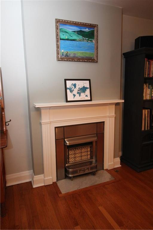 542 Bigham Road Pittsburgh, PA 15211 - Photo 6 of 25 The charming fireplace with original (now decorative) insert bring character to this home.