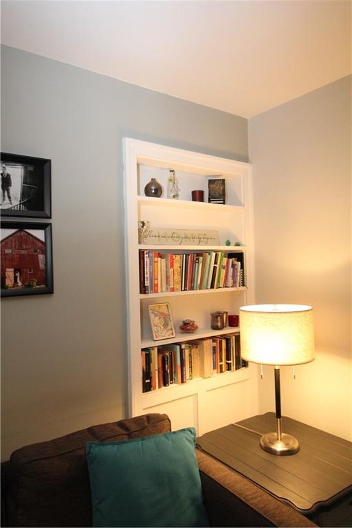 542 Bigham Road Pittsburgh, PA 15211 - Photo 7 of 25 Built-in shelves in the living room add to the charm of this home.
