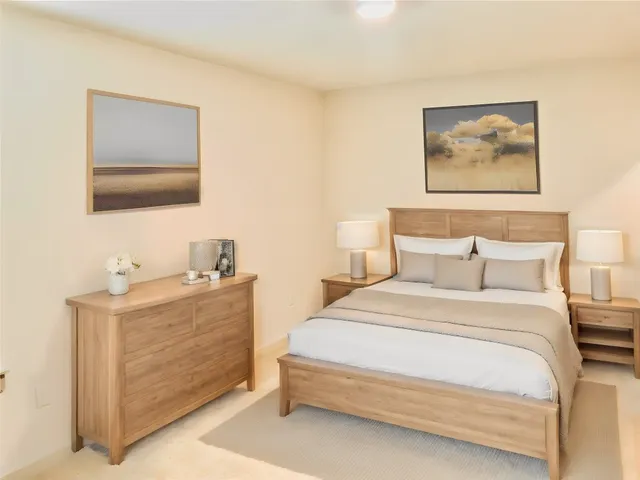 a bedroom with a bed and a bathroom