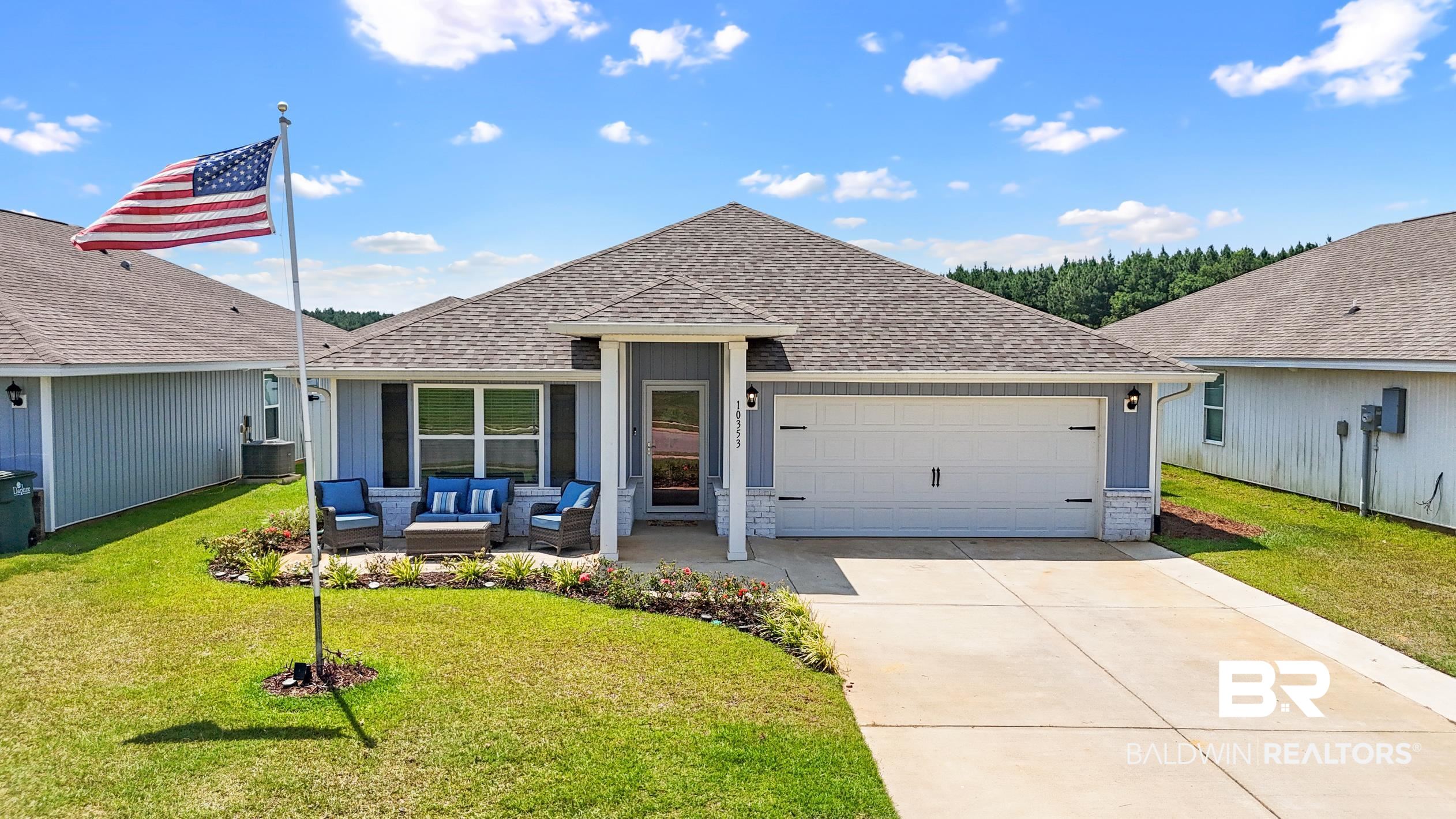10353 Zenyatta Loop Daphne, AL 36526 - Photo 1 of 33 Ranch-style house featuring a front lawn, outdoor lounge area, cooling unit, and a garage