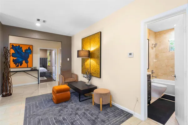 a view of living room filled with furniture and rug