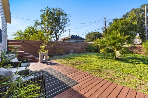 a view of a backyard with sitting area