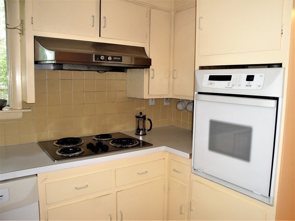 63 Lakeshore Road Natick, MA 01760 - Photo 17 of 30 a kitchen with a stove and a microwave