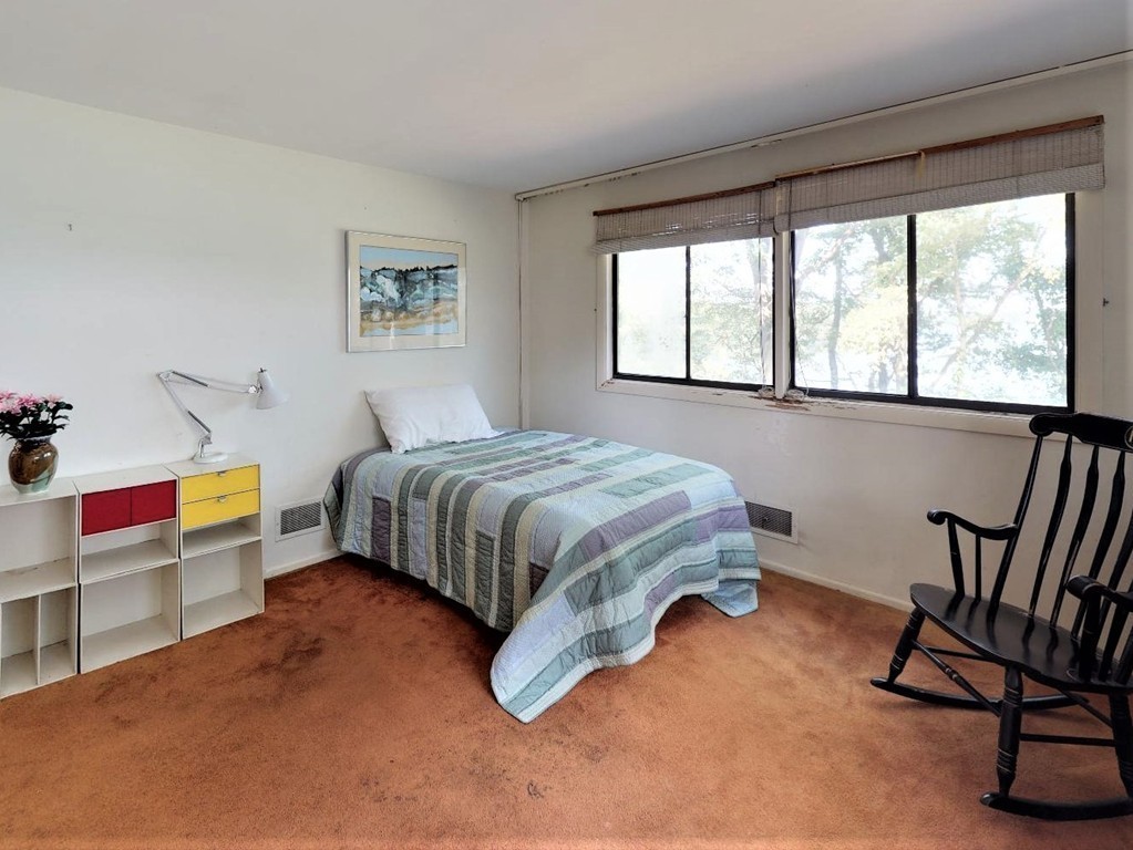 63 Lakeshore Road Natick, MA 01760 - Photo 21 of 30 a bedroom with a bed chair and window