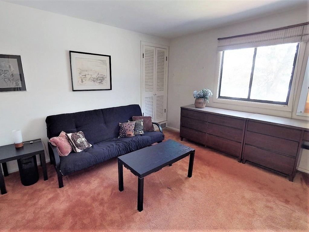 63 Lakeshore Road Natick, MA 01760 - Photo 26 of 30 a living room with furniture and a window