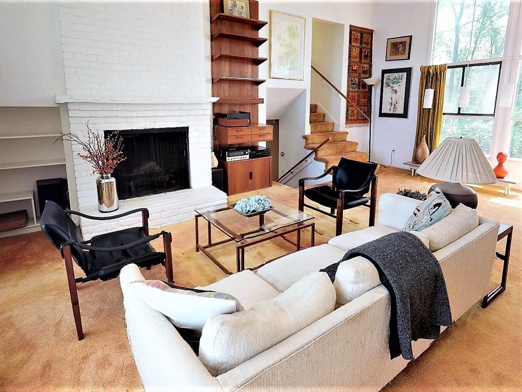 63 Lakeshore Road Natick, MA 01760 - Photo 4 of 30 a living room with furniture a fireplace and a large window