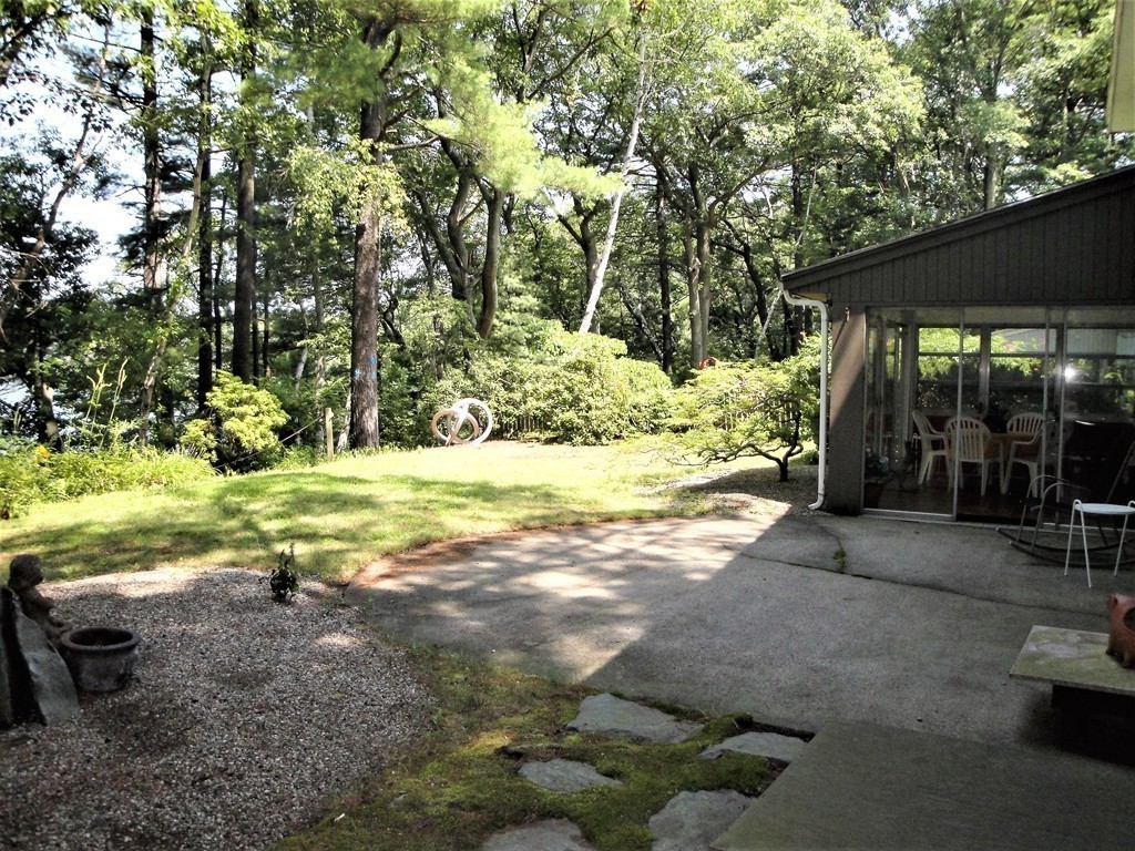 63 Lakeshore Road Natick, MA 01760 - Photo 9 of 30 a view of a yard with an empty space