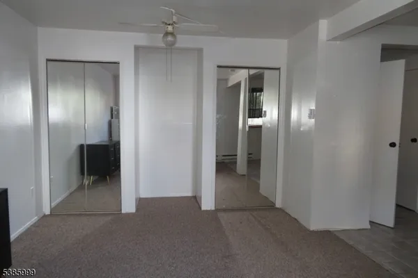 an empty room that has a mirror