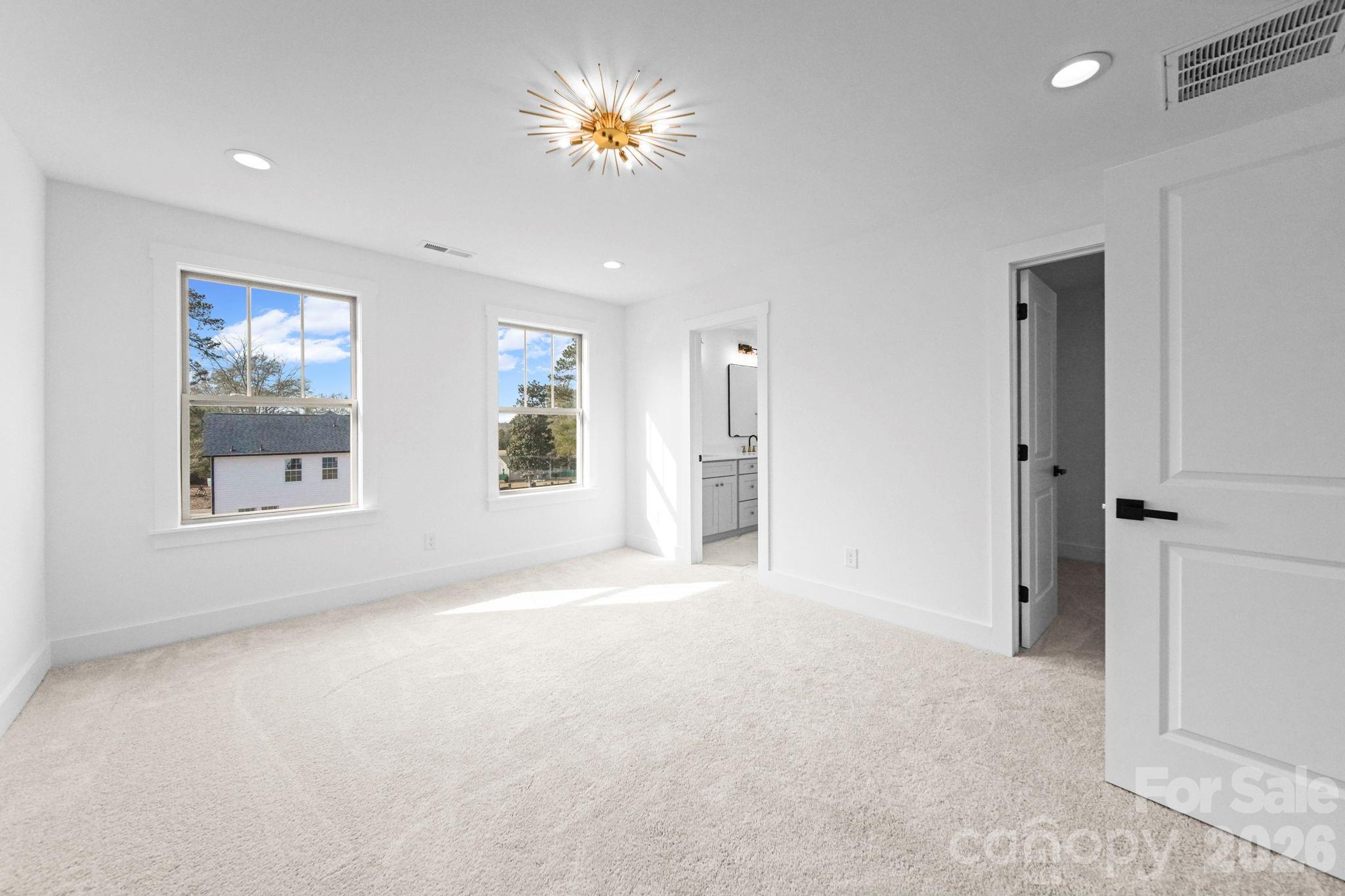 1220 Morven Road Wadesboro, NC 28170 - Photo 15 of 17 an empty room with windows and closet